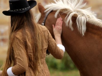 woman walking with horse at healing through horses